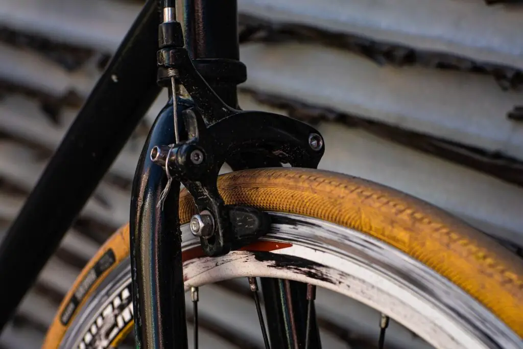 Image of a black fixie bike brakes. Source: Unsplash