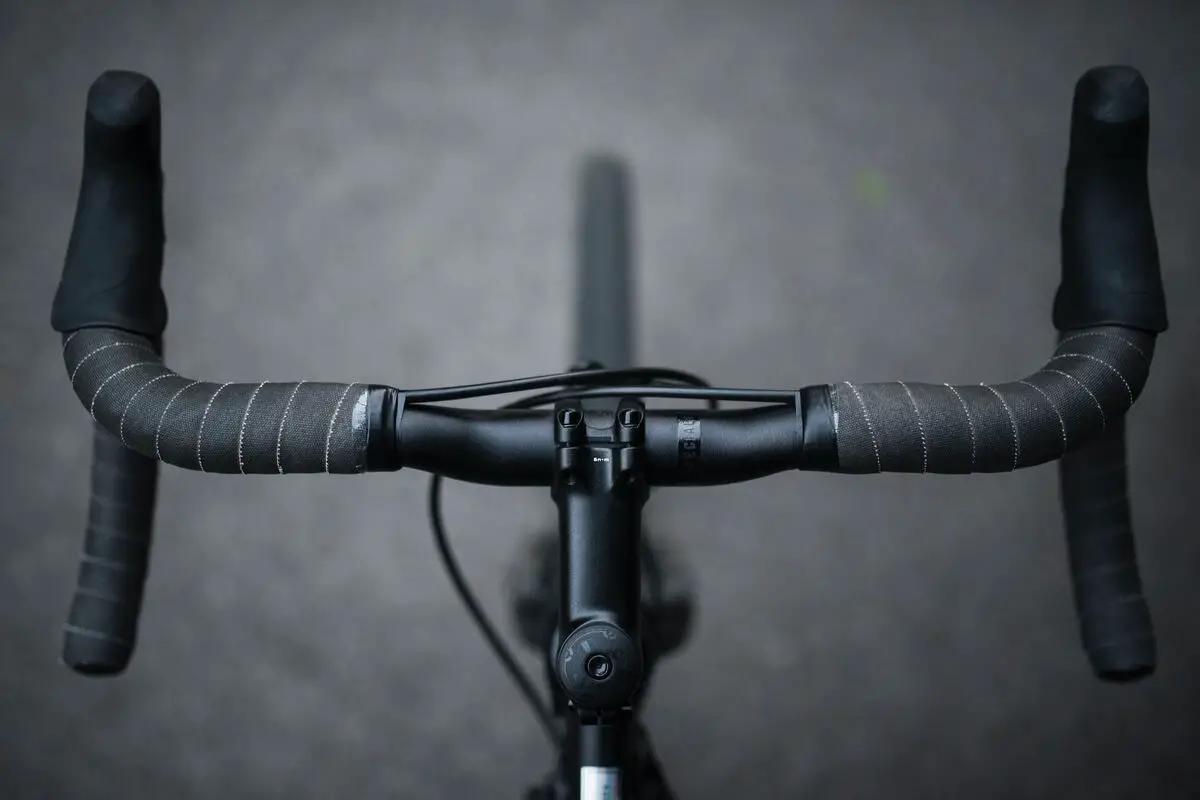 Image of a black bicycle drop handlebar source: unsplash