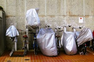 Image of bicycles parked outside and covered. Source: Wiki Commons