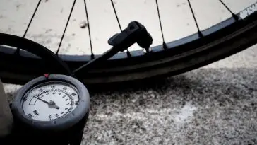 Bike tire getting inflated with gauged air pump. Source: TheDigitalWay, Pixabay