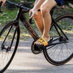 Cyclist wearing flip flops doing a track stand on a specialized fixed gear bike. Source: Lukas Smith, Unsplash