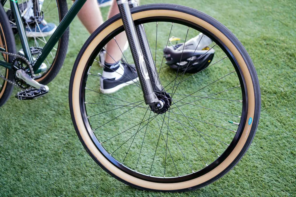 Image of a black and cream bike wheel. Source: yomex owo unsplash