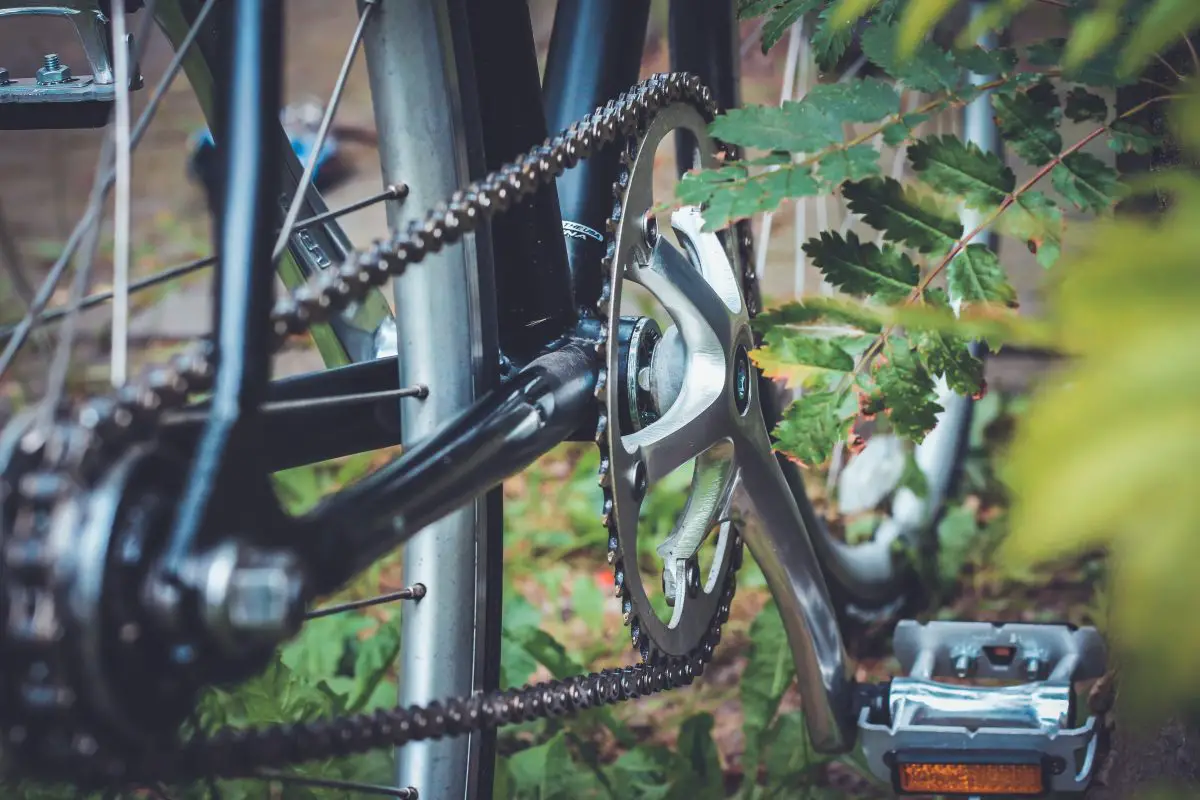 Image of a black bike with chain and pedals. Source: brina blum, unsplash