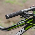 Image of a black and green colored bike with a Shimano bike brake. Source: D Castle, Pexels