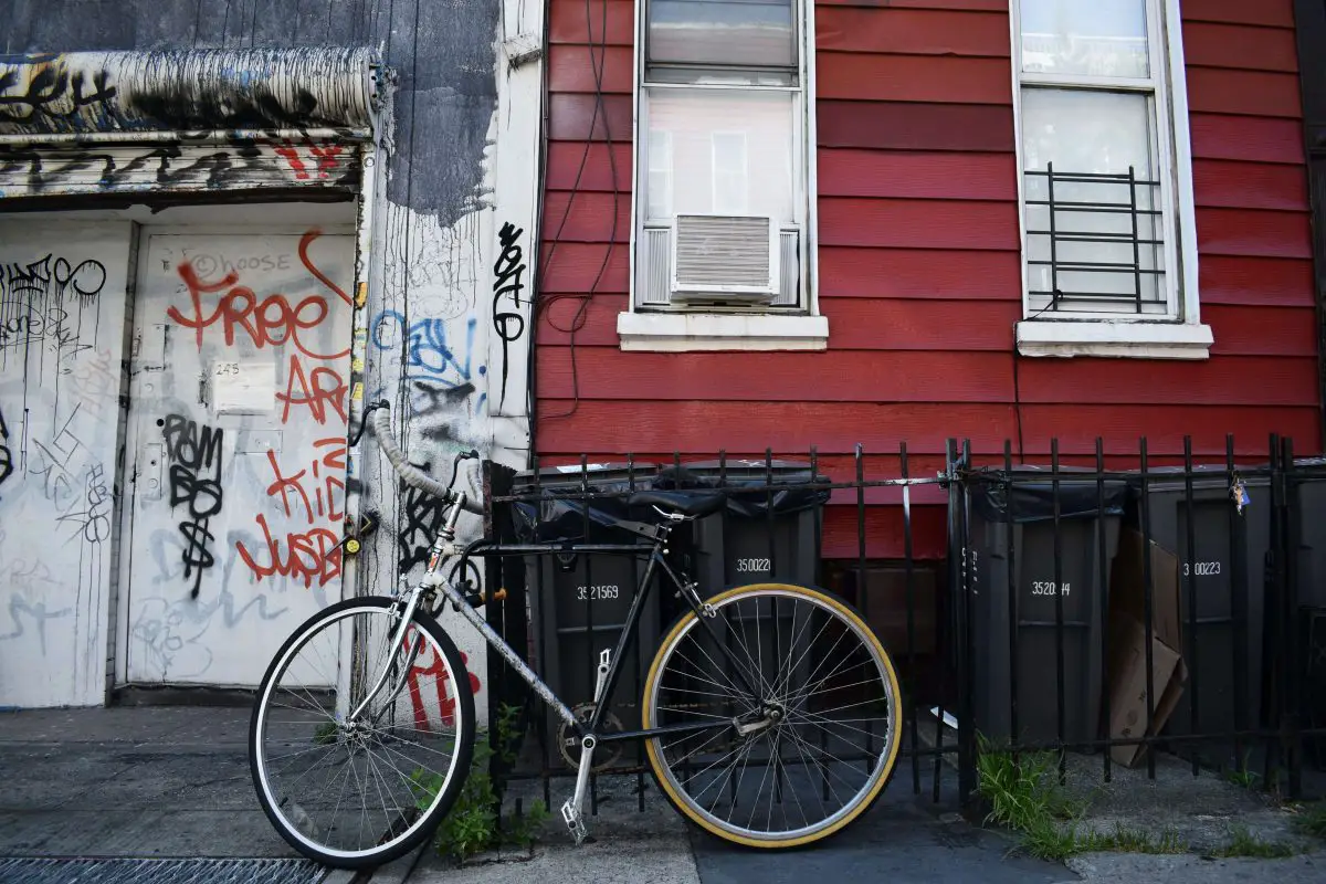 Bike locked outside of brooklyn apartment in new york city unsplash