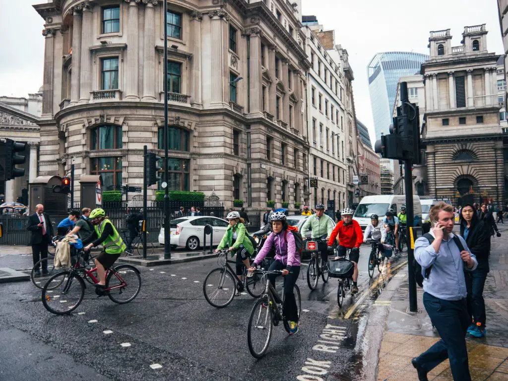 A group of cyclists on a busy street. Source: unsplash
