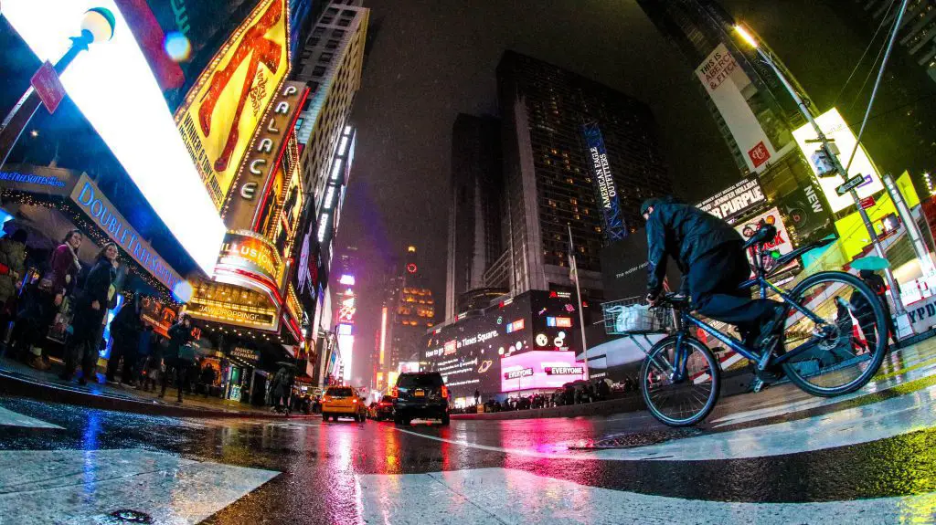Man on a bike in the streets of new york. Source: unsplash